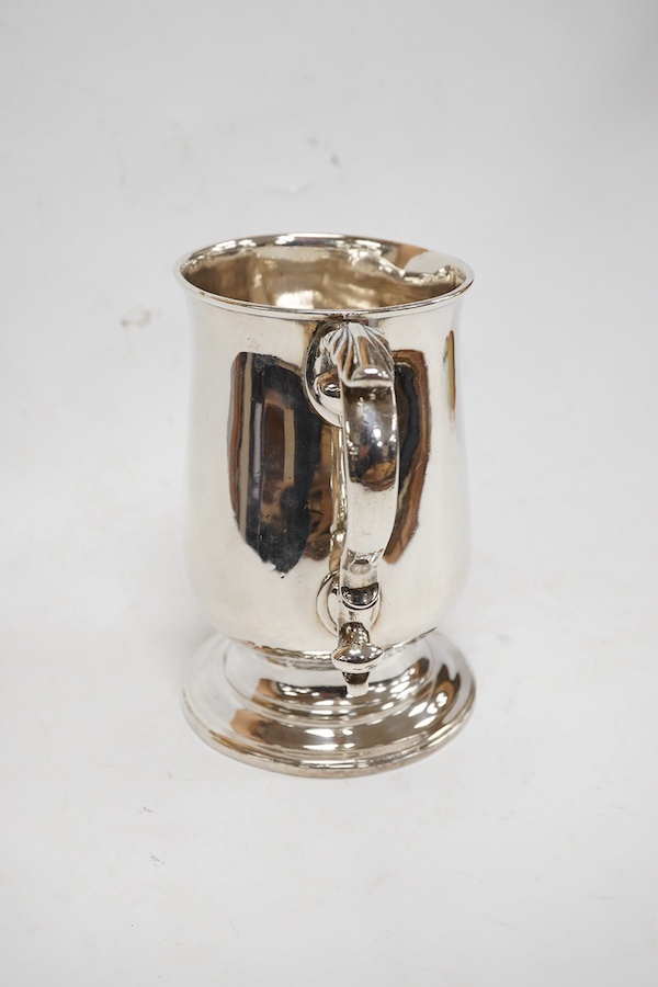 A George III silver baluster mug, with acanthus leaf capped handle, William Turton, London, 1782, height 15.5cm, 10.4oz. Condition - poor to fair